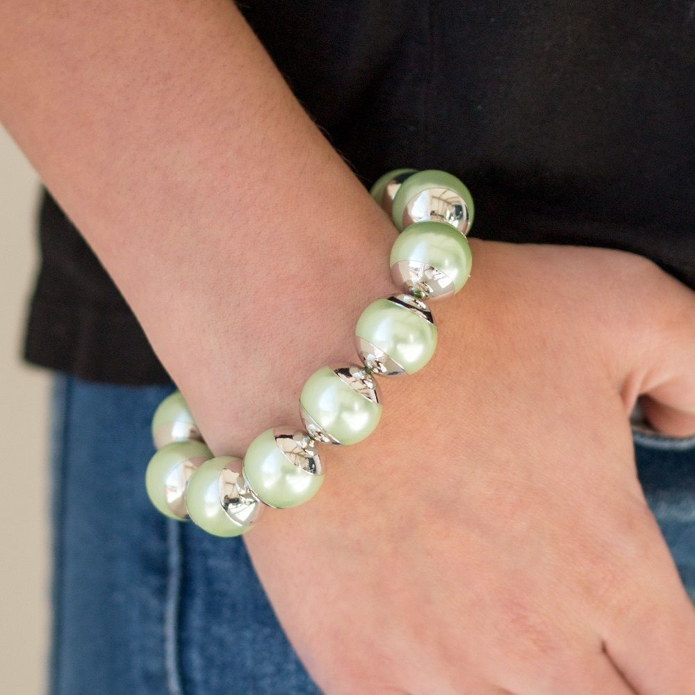 Sea foam green peal bead with silver caps on each side stretchy band bracelet